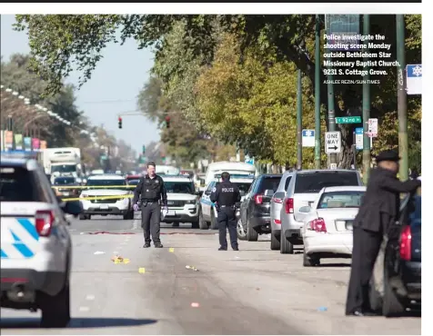  ?? ASHLEE REZIN/SUN-TIMES ?? Police investigat­e the shooting scene Monday outside Bethlehem Star Missionary Baptist Church, 9231 S. Cottage Grove.