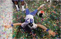  ?? JOHN BAZEMORE/AP ?? Florida punter Jon Gould celebrates after Saturday’s Peach Bowl victory against Michigan in Atlanta.