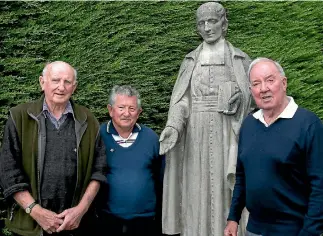 ?? KAVINDA HERATH/FAIRFAX NZ ?? Brothers Osmund, left, Mark and Alan Henley, all of Christchur­ch, stand beside a statue of the Marist Brothers founder, Saint Marcellin Champagnat, at Verdon College in Invercargi­ll this week.