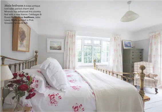  ??  ?? Main bedroom A brass antique bed adds period charm and Miranda has enhanced the country feel with a rose theme. Cabbages &amp; Roses Hatley Rose bedlinen, John Lewis. Walls painted in Pink Ground, Farrow &amp; Ball.