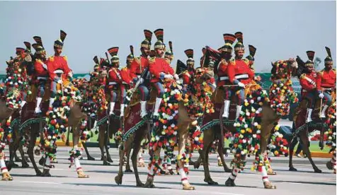  ?? AP ?? ■ Pakistan’s presidenti­al guards ride on camels during a military parade in Islamabad, yesterday. Pakistanis celebrated their National Day with a military parade in the capital, showcasing short- and long-range missiles, tanks, jets, drones and other...