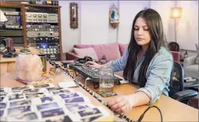  ??  ?? At left, Gena Johnson works in her home studio in Nashville, Tenn. She is the first woman to ever be nominated for engineer of the year by the Academy of Country Music.