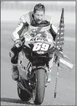  ?? AP file photo ?? American Nicky Hayden, shown after winning the world MotoGP title in 2006, died Monday from injuries suffered when the bicycle he was riding was struck by a car along the Rimini coast in Italy on Wednesday. He was 35.