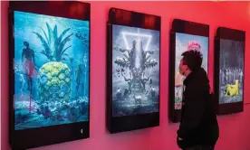 ?? Photograph: Nicolas Asfouri/AFP/Getty Images ?? Meteoric rise … digital paintings by US artist Beeple at an NFT exhibition.