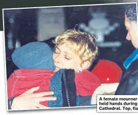  ??  ?? A female mourner hugs a child while others held hands during a vigil at Dunblane Cathedral. Top, floral tributes in the town