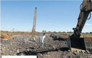  ?? Picture: Alon Skuy ?? Argent business person Abu Baker Omar in the giant sinkhole in Delmas that is affecting traffic and business in the area as repairs fall months behind schedule.