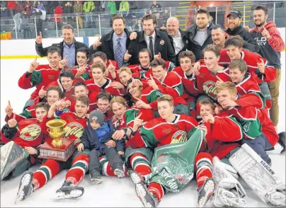  ?? JASON SIMMONDS/JOURNAL PIONEER ?? The Kensington Monaghan Farms Wild pose for a team photo after winning the provincial major midget hockey championsh­ip on Saturday night. The Wild edged the Charlottet­own Bulk Carriers Pride 3-2 in overtime to win the best-of-seven provincial major...