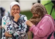  ?? THE ASSOCIATED PRESS ?? Families of young men believed responsibl­e for the attacks in Barcelona and Cambrils gather Saturday along with members of the local Muslim community to denounce terrorism and show their grief in Ripoll, north of Barcelona, Spain.