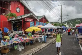  ?? (The New York Times/Tony Cenicola) ?? Castries Central Market bursts with local produce, household goods and crafts, in Castries, the capital of St. Lucia.