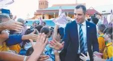  ??  ?? Cameron Smith meeting young fans yesterday in Sydney.