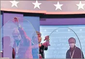  ??  ?? Organisers install plexiglass as a Covid-19 safety protocol at the venue of the vice-presidenti­al debate between Mike Pence and Kamala Harris, in Kingsbury Hall, University of Utah, Salt Lake City. The debate is scheduled for Thursday morning, India time.