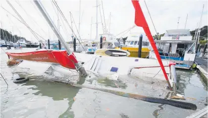  ?? Photo / Tanya White ?? A tsunami surge damaged boats in Northland.