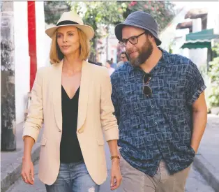  ?? LIONSGATE ?? Charlize Theron, left, and Seth Rogen team up in Long Shot, a rom-com that has Rogen in the Cinderella role this time around.