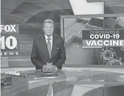  ?? COURTESY OF FOX 10 ?? Fox 10 news anchor John Hook on the set. Hook missed three weeks of work after contractin­g COVID-19.