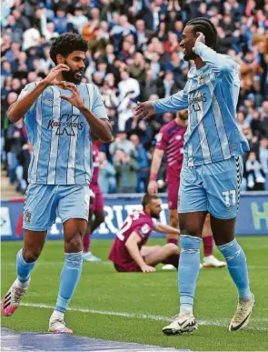  ?? ?? Coventry City’s Ellis Simms (left) celebrates scoring their side’s goal
