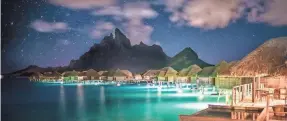  ?? PROVIDED BY TREY RATCLIFF/FOUR SEASONS RESORT BORA BORA ?? For the ultimate stargazing getaway, go to the Four Seasons Resort Bora Bora, where the overwater bungalows make for the perfect spot to lounge and look up at the stars.