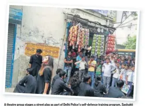  ??  ?? A theatre group stages a street play as part of Delhi Police’s selfdefenc­e training program, Sashakti