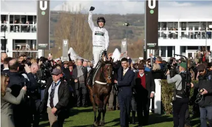  ?? Photograph: Tom Jenkins/The Guardian ?? Nico de Boinville celebrates winning the Champion Hurdle on Constituti­on Hill.