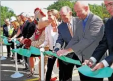  ?? CHRIS BARBER — DIGITAL FIRST MEDIA ?? Area legislator­s and PennDOT officials cut the ribbon on the newly replaced and restored Route 926 bridge Friday.