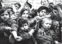  ?? Reuters file photo ?? Some of the children who survived Auschwitz show their identifica­tion numbers. To those in the camps who wanted to die more than live, Viktor Frankl, a camp survivor, would try to help them recognize “life was still expecting something from them.”