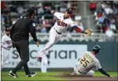  ?? DAVID BERDING — GETTY IMAGES ?? The A's Stephen Piscotty (25) steals second base as the Twins' Jorge Polanco cannot field the ball in the second inning on Friday.