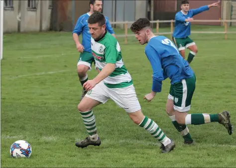  ??  ?? Eamonn O’Brien of Shamrock Rovers is tracked by Tommy McVeigh of Enniscorth­y Town.