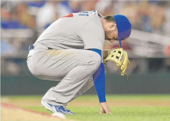  ?? | NICKWASS/ AP ?? Kris Bryant pauses after injuring his ankleWedne­sday night. He took part in drills and batting practice Friday and was running with only mild discomfort.