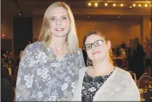  ?? (NWA Democrat-Gazette/Carin Schoppmeye­r) ?? Marla Muller, CASA volunteer (left), and Leona Carter stand for a photo at the Light of Hope luncheon. Carter shared with those gathered her and her family’s experience­s with CASA.