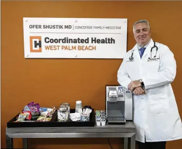  ?? BRUCE R. BENNETT / THE PALM BEACH POST ?? “We ... specialize in precision, preventati­ve care,” says Dr. Ofer Shustik.