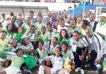  ??  ?? Falconets players and their officials celebrate after winning the gold medal in women's football event at the just concluded All Africa Games in Rabat, Morocco