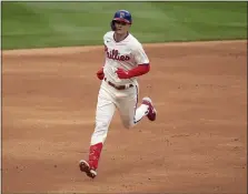  ?? CHRIS SZAGOLA - THE ASSOCIATED PRESS ?? The Phillies’ Mickey Moniak rounds the bases after hitting a three-run home run in the second inning against San Francisco Wednesday. It was the first home run of Moniak’s major league career.