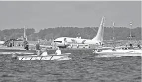  ?? AP ?? A charter plane carrying 143 people and traveling from Cuba to north Florida dropped into a river at the end of a runway Saturday in Jacksonvil­le, Fla.