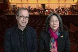  ?? Lori Van Buren / Times Union ?? Conductor David Alan Miller and Anna Kuwabara, the executive director of the Albany Symphony Orchestra.