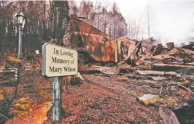  ?? ASSOCIATED PRESS FILE PHOTO ?? Smoke rises from the remains of the Alamo Steak House in November 2016 in Gatlinburg, Tenn., after a wildfire swept through the area.