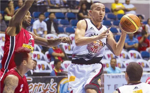  ??  ?? Mike Cortez of Ginebra looks for an open man as he runs into Ronald Tubid and Leroy Hickerson of Barako Bull.