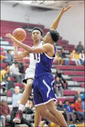  ?? KYLE TELECHAN/POST-TRIBUNE ?? Bowman guard Koron Davis tries to get a shot up past Hammond’s Jamar Styles on Feb. 8. Bowman coach Tyrone Robinson said Davis averaged about 20 points over the final month of last season.