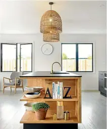 ??  ?? Your dream kitchen won’t be cheap but you can stamp it with your own style by using bold colours, statement pendant lights and furniture.