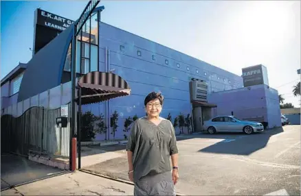  ?? Photograph­s by Marcus Yam Los Angeles Times ?? EUNICE KIM, a Korean immigrant and fashion designer, bought the big, purple building with plans to create a cultural center.