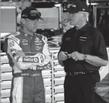  ?? CHARLOTTE OBSERVER FILE PHOTO ?? Matt Kenseth and team owner Joe Gibbs talk at Charlotte Motor Speedway in May. Kenseth and Carl Edwards are teammates again.