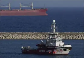  ?? Petros Karadjias/Associated Press ?? A ship belonging to the Open Arms aid group -— one of three ships loaded with canned food destined for Gaza —- has returned to the Cypriot port of Larnaca, Cyprus. Some 240 tons of undelivere­d aid were waiting in its port after several aid workers were killed.