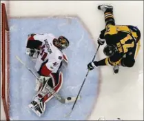  ?? GENE J. PUSKAR, THE ASSOCIATED PRESS ?? Ottawa Senators goalie Craig Anderson stops a shot by Pittsburgh Penguins’ Evgeni Malkin in the second period of Game 1 on Saturday night.