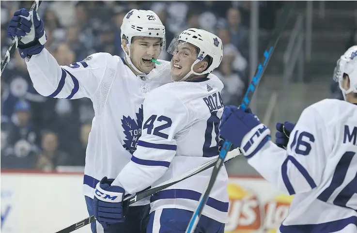  ?? — KEVIN KING ?? Maple Leafs forward James van Riemsdyk celebrates a goal with Tyler Bozak Wednesday as Toronto pummeled the Jets 7-2 at Bell MTS Centre in Winnipeg.