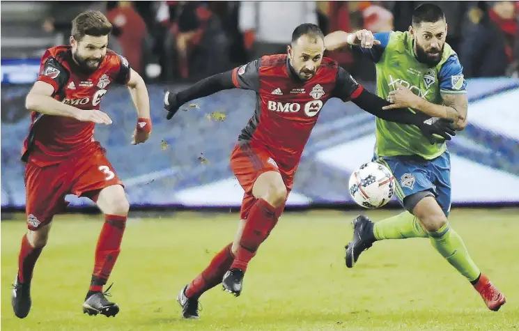  ?? NATHAN DENETTE/THE CANADIAN PRESS ?? Drew Moor, left, Victor Vazquez, centre, and their Toronto FC teammates will learn their CONCACAF Champions League opponent on Dec. 18.