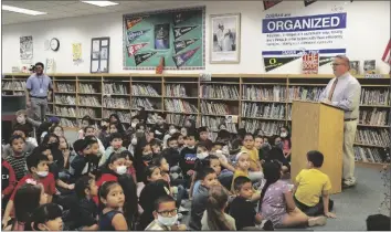  ?? LOANED PHOTOS FROM DISTRICT ONE ?? STUDENTS AT G.W. CARVER ELEMENTARY library’s reading space. gathered Wednesday for the dedication of their