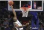  ?? KAREN PULFER FOCHT - THE ASSOCIATED PRESS ?? Memphis’ James Wiseman (32) dunks against South Carolina State during the first half of a game Tuesday, Nov. 5, 2019, in Memphis, Tenn.