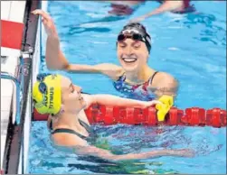  ?? GETTY IMAGES ?? Ariarne Titmus (left) and Katie Ledecky after the 400m freestyle final on Monday.