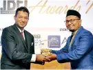  ??  ?? Shaikh Zaid Nooramith, In-House Advisor – CLC-IBD, accepting the Award