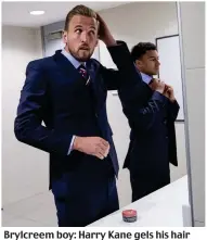  ??  ?? Brylcreem boy: Harry Kane gels his hair while Jesse Lingard straighten­s his tie