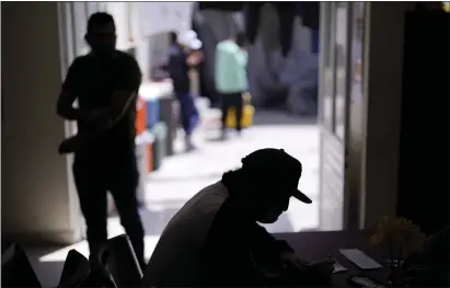  ?? GREGORY BULL — THE ASSOCIATED PRESS ?? A man from Nicaragua sits at a shelter for migrants in Tijuana, Mexico, on Thursday.