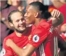  ??  ?? ANT’S POT SHOT: Martial celebrates his goal against Stoke with Daley Blind